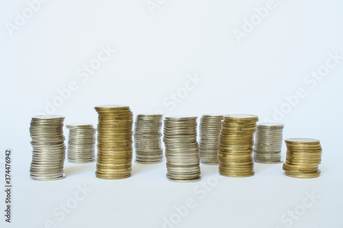 Money saving, financial growth concept. Stacked of coins in white background.