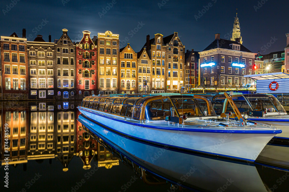 Amsterdam Damrak traditional Dutch architecture at night