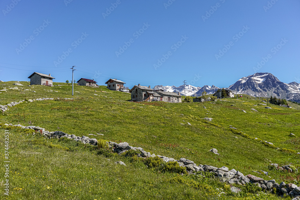 The pastures, the mountains and the nature while hiking above the village of Madesimo, Italy - June 2020.