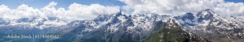 A panoramic view of the mountains and the nature of the spluga valley, near the town of Madesimo, Italy - June 2020.