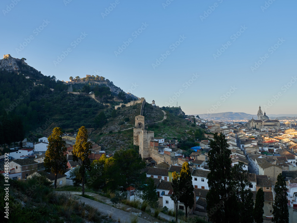 View of the city of Xativa, with the eastern wall in the center and the castle on the left, Spain
