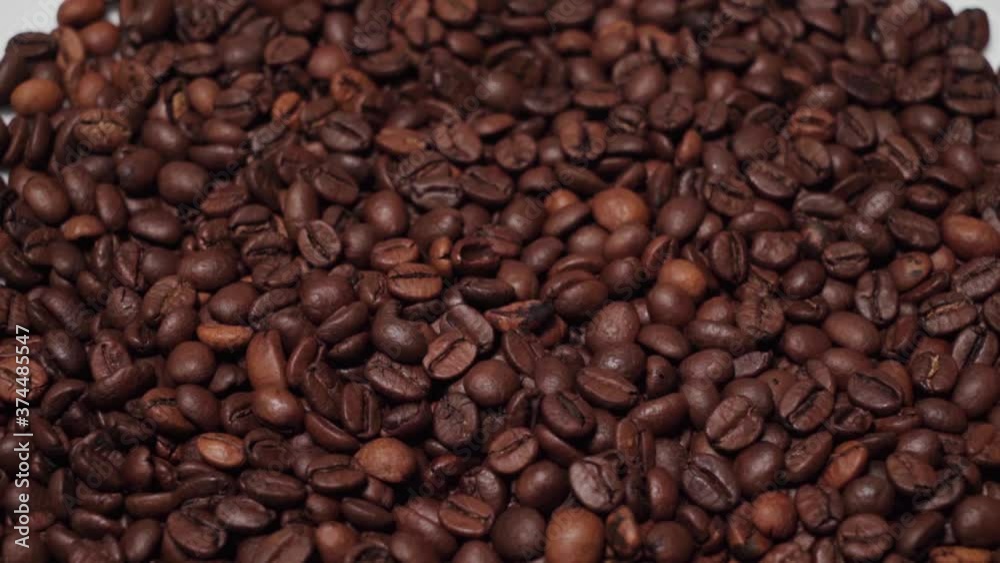 Tilt Down, Pile of Coffee Beans Isolated on White Background, Closeup Tilt Down, Pile of Coffee Beans Isolated on White Background, Closeup
