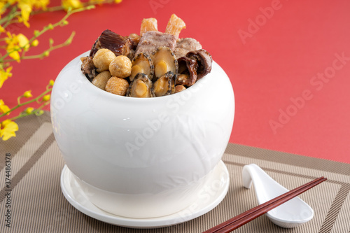 Traditional food of Chinese lunar new year, Buddha jumps over the wall, Chinese Soup Casserole dish, Buddha's Temptation, named Fo Tiao Qiang, close up. photo