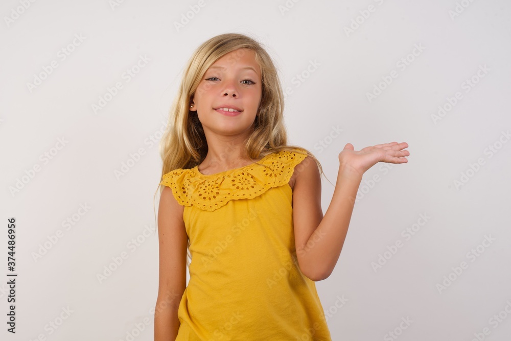Young handsome european man wearing red shirt and glasses over isolated red background smiling cheerful presenting and pointing with palm of hand looking at the camera. Young handsome european man wearing red shirt and glasses over isolated red background smiling cheerful presenting and pointing with palm of hand looking at the camera.