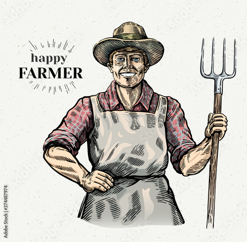 Happy and smiling farmer with a pitchfork in his hands.