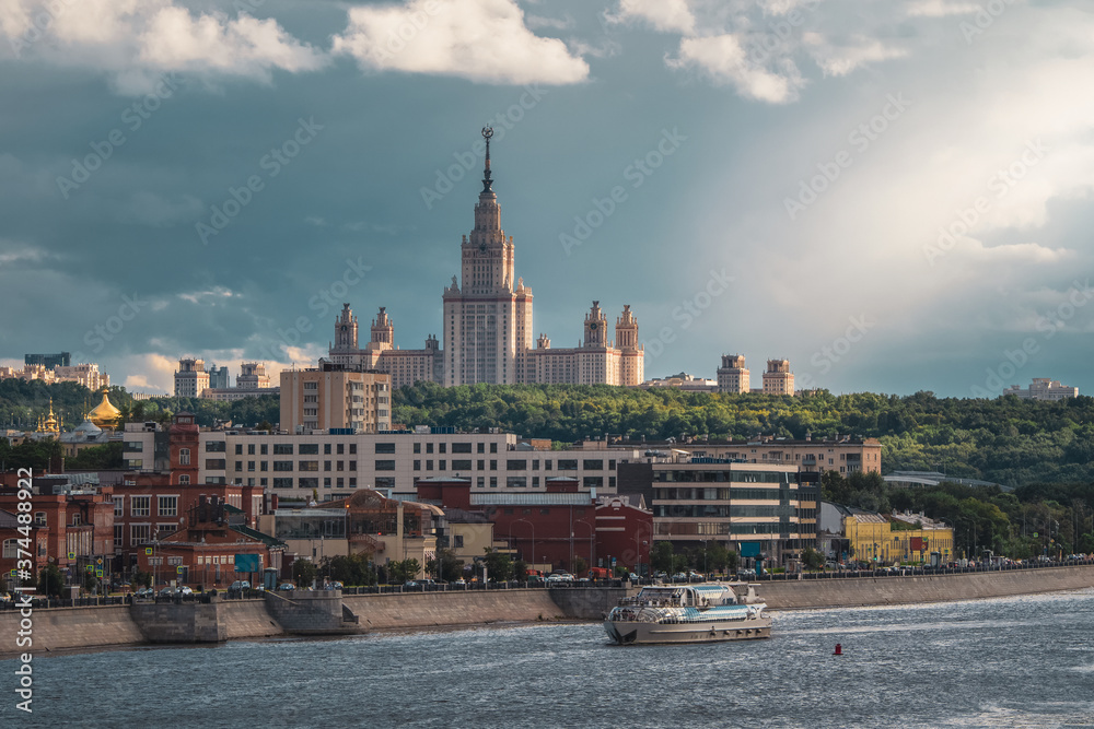 Beautiful Moscow evening  cityscape. Moscow State University on a green hill in the evening sun.