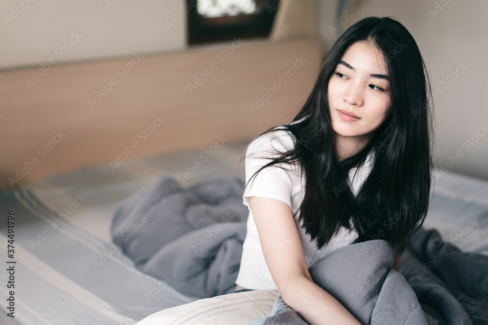 Young adult asian woman has lazy and burnout from work in the morning Young adult asian woman has lazy and burnout from work in the morning