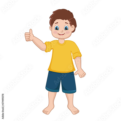 A small schoolboy boy in a t shirt and shorts with a fashionable hairstyle