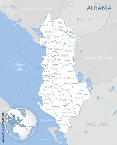Blue-gray detailed map of Albania administrative divisions and location on the globe.