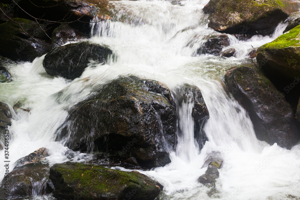 Fototapeta premium Cascades around rocks