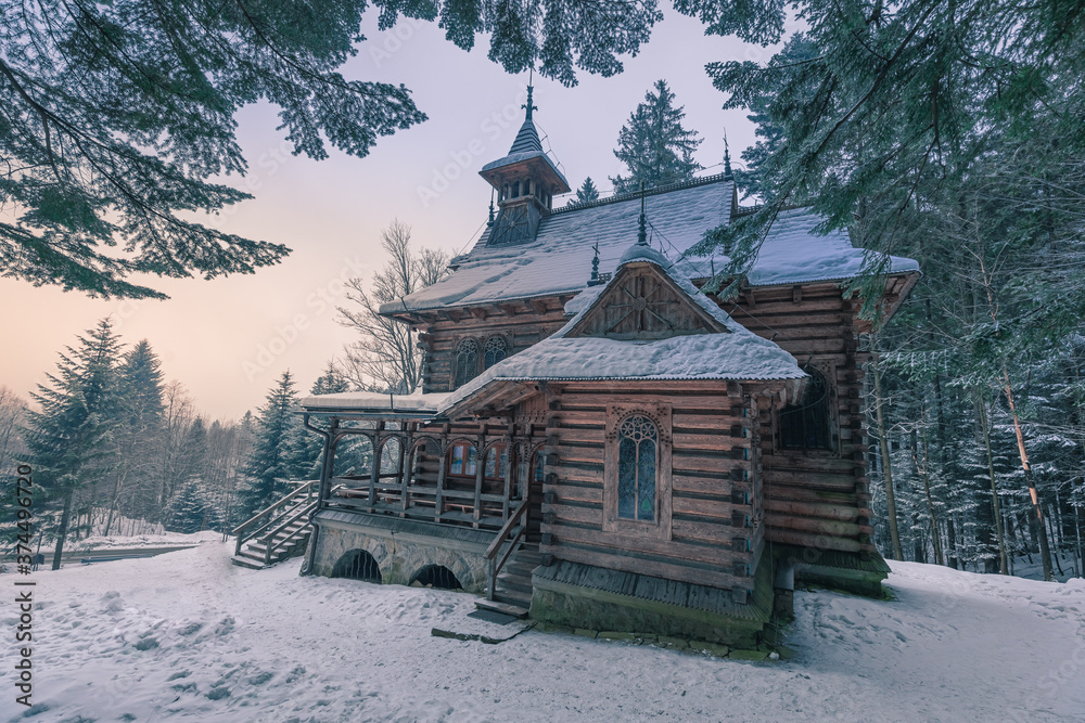 Old chapel Jaszczurowka in Zakopane at winter sunset