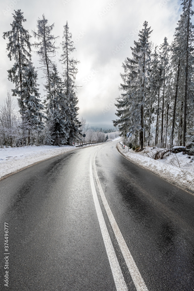 Snowy black asphalt road in Tatra mountains, Poland Snowy black asphalt road in Tatra mountains, Poland