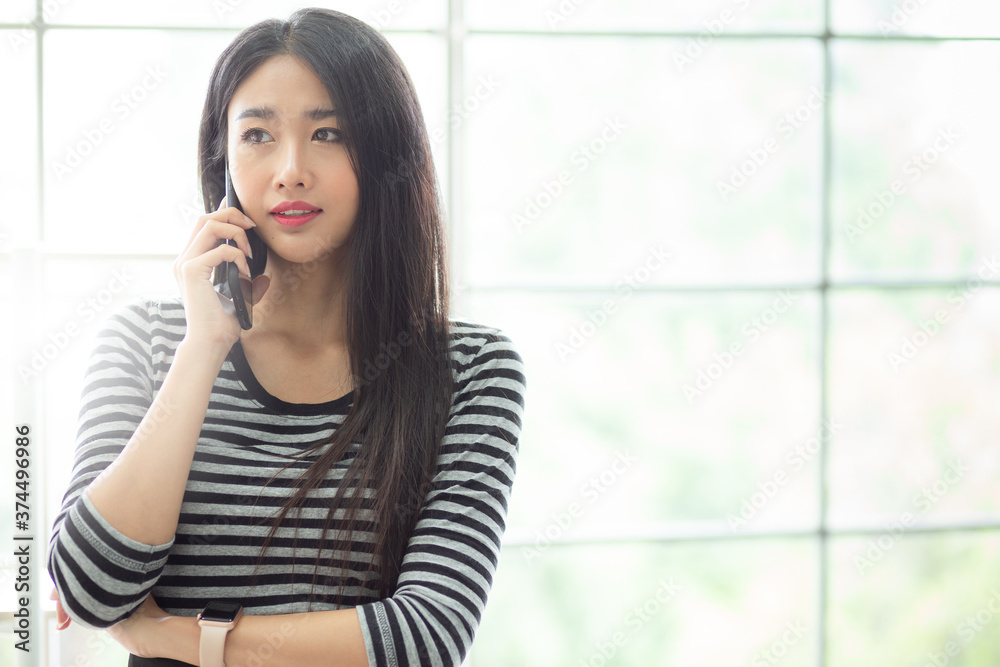 Portrait Young Office Woman Talking to business partner on her Mobile Phone. Communication, technology and people concept Portrait Young Office Woman Talking to business partner on her Mobile Phone. Communication, technology and people concept