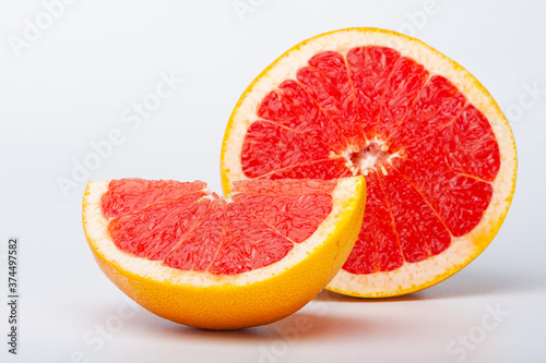 Grapefruit citrus fruit with half on white with clipping path