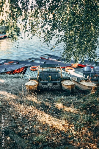 Wallpaper Mural Old boats and a catamaran on the river bank. Torontodigital.ca