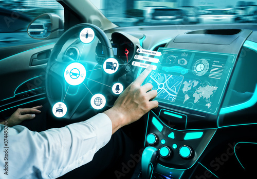 Driverless car interior with futuristic dashboard for autonomous control system . Inside view of cockpit HUD technology using AI artificial intelligence sensor to drive car without people driver . photo