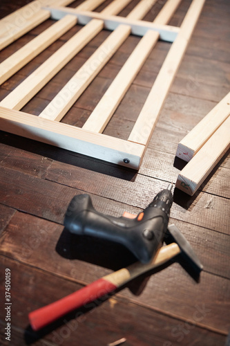 Carpenter hobbyist tools and wooden boards at home / garage.