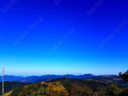 Mountain landscape with blue sky.