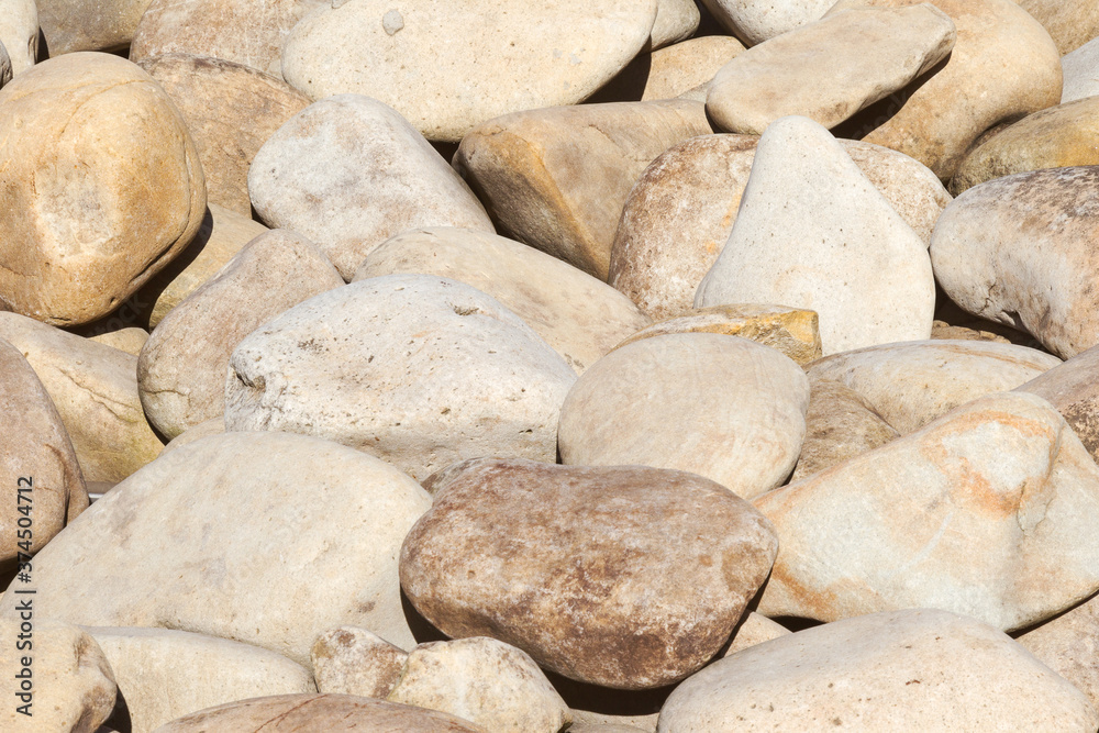 lot of stones close-up on beach, pebbles as textured background lot of stones close-up on beach, pebbles as textured background
