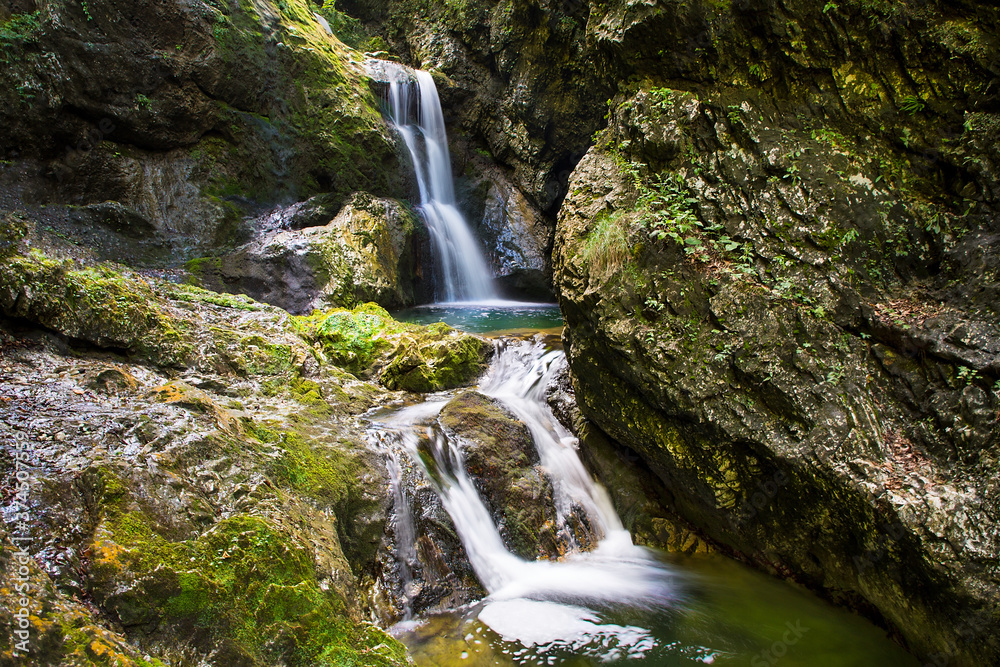 Fototapeta premium Majestic waterfalls on the stream Gačnik, Soca valley, Slovenia, Europe