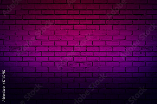 Lighting effect neon light on brick wall texture for background.