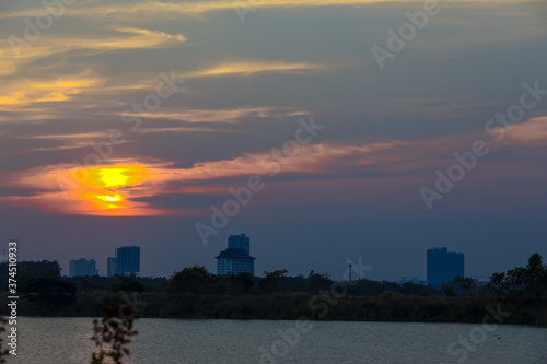 Silhouette of building in the city sunset or sunrise moment © jirateep