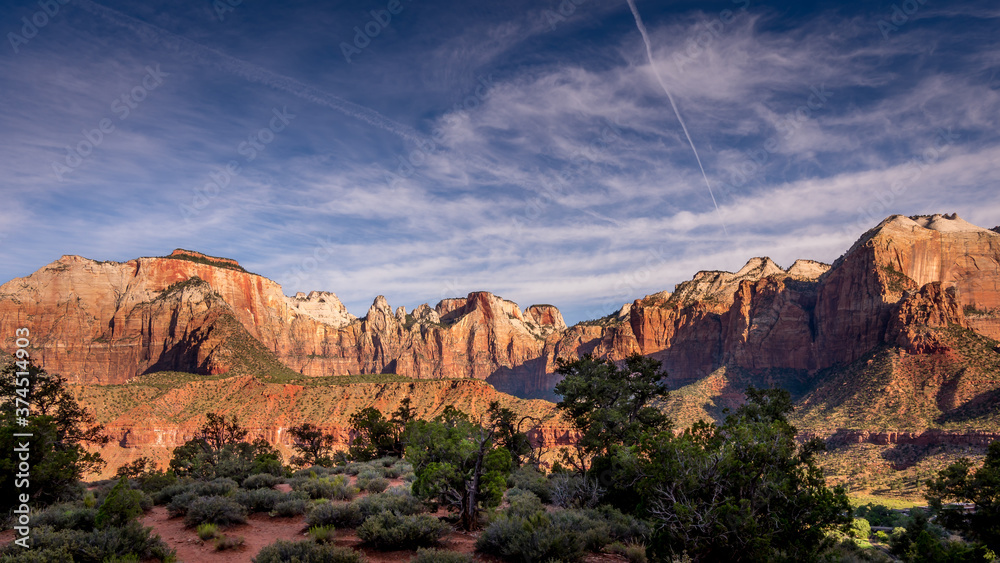Sunrise over Mt. Kinesava and The West Temple in Zion National Park in Utah, USA, during an early morning hike on the Watchman Trail
