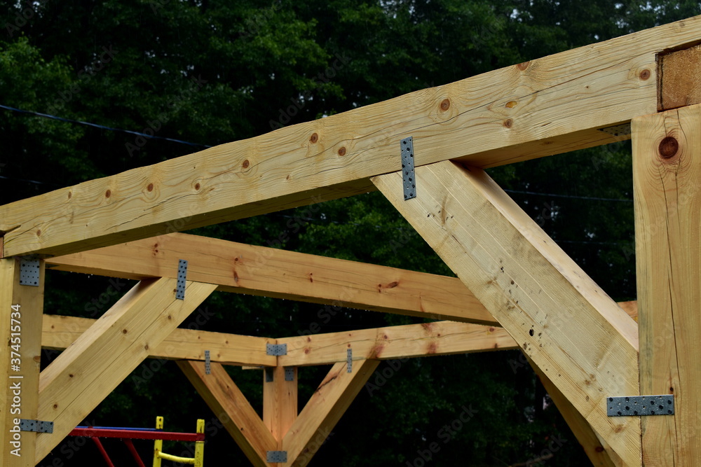 wooden pillars of a large gazebo under construction wooden pillars of a large gazebo under construction