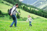 Father Playing With Child Girl In Mountains In Austria