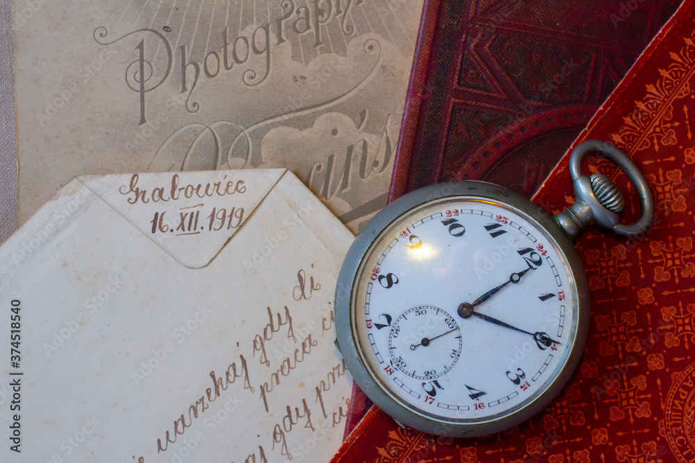 Antique pocket watch with Victorian items. Old books and photographs. Vintage theme background. Antique pocket watch with Victorian items. Old books and photographs. Vintage theme background.