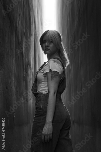  Girl in overalls between two walls