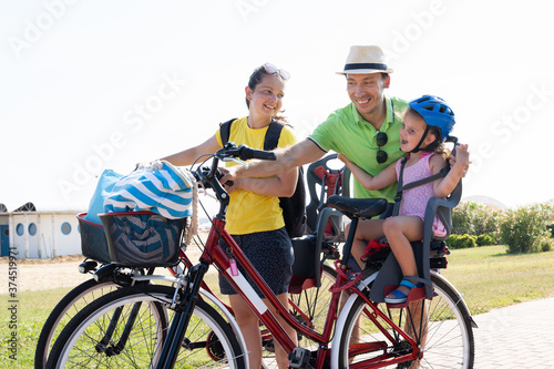 Family Riding Bicycle Outside