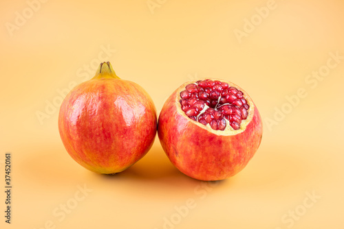 Delicious pomegranate fruit ripe in autumn photo