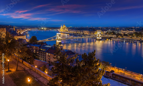 Beautiful evening image of Budapest, incredible view on Budapest cityscape, with streetlight and colorful sky during sunset. wonderful picturesque Scene. Popular Travel destinations. perfect postcard