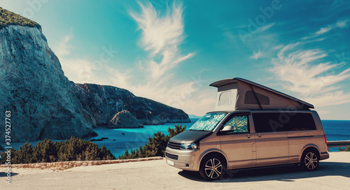 Fototapeta Naklejka Na Ścianę i Meble -  Beautiful summer seascape. ?ar camper near Most Famous Porto Katsiki Beach of sunny day. Scenic Image Ionian Sea. Lefkada, Greece.Travel on car is Lifestyle, conception. Idea of Adventure lifestyle.