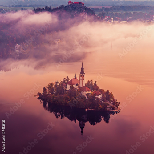 Lake Bled, Slovenia.  Beautiful aerial view of Lake Bled during sunset. Iconic location for landscape photographers. Idea of Adventure lifestyle. Beautiful in the world © jenyateua