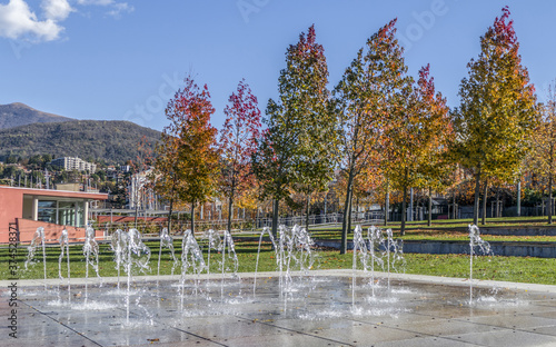 Foliage in Luino in a park with a little fountains