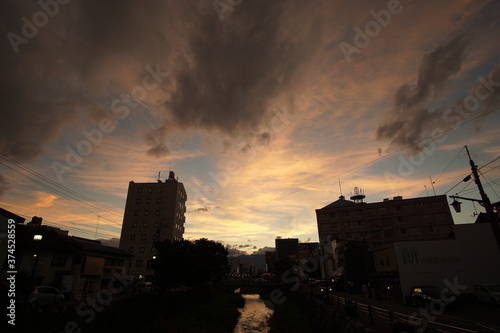 sunset scene of small town with street lights in Japan, Matsumoto