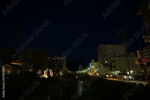 Night scene of small town with street lights in Japan, Matsumoto.