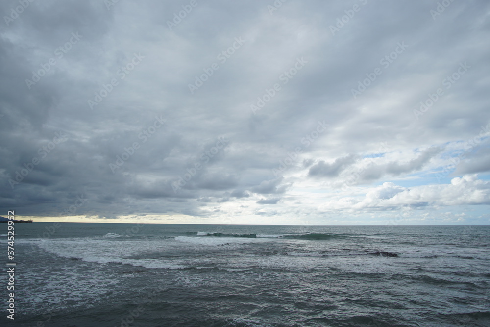 blue sea and cloudy sky over it. Blue Sea sky and Clouds