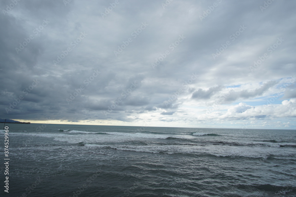 blue sea and cloudy sky over it. Blue Sea sky and Clouds