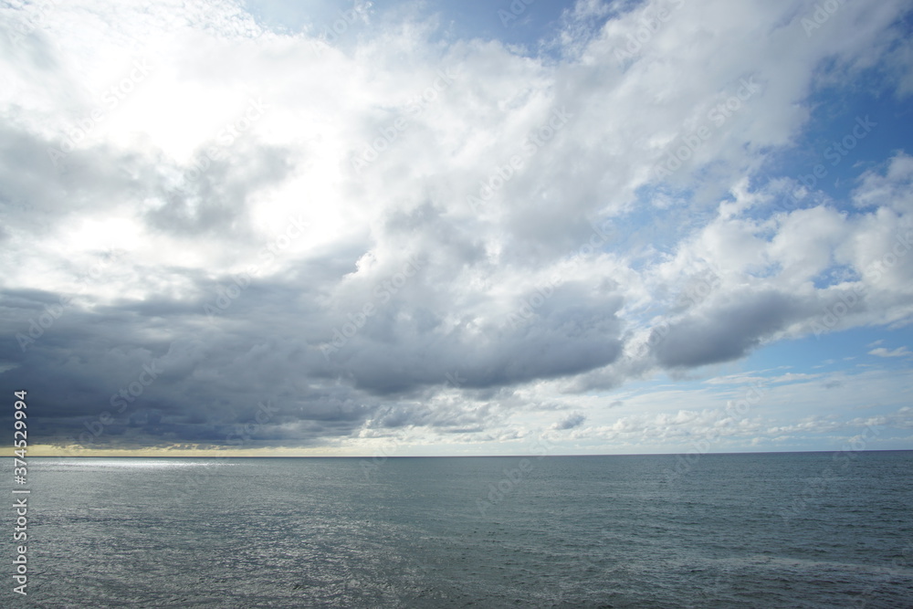 blue sea and cloudy sky over it. Blue Sea sky and Clouds