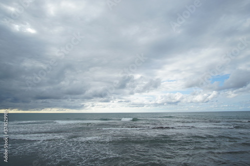 blue sea and cloudy sky over it. Blue Sea sky and Clouds