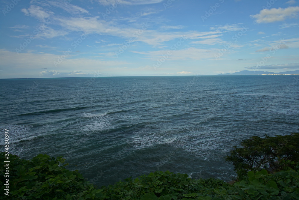 perfect blue sky with clouds and water of the sea