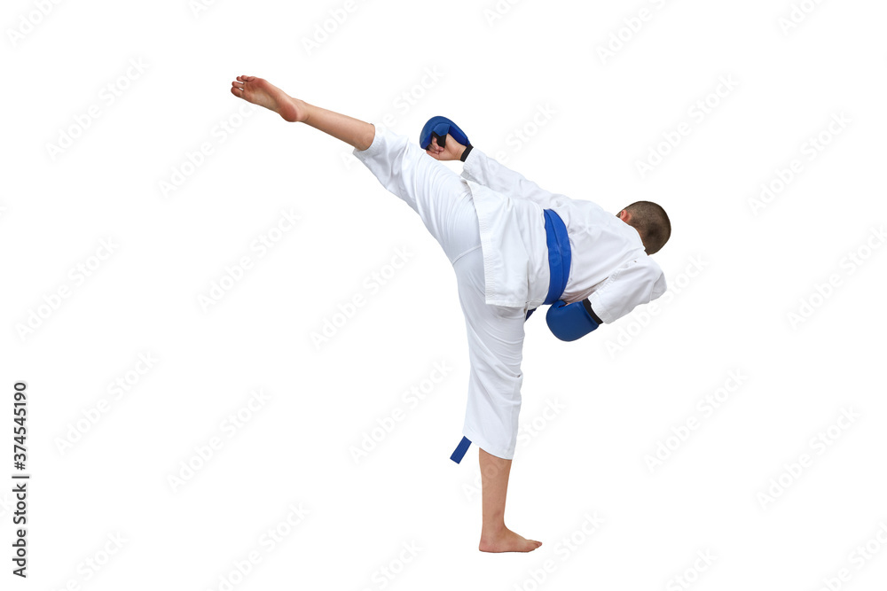 Athlete in karategi with blue belt beats kick kick on white isolated background Athlete in karategi with blue belt beats kick kick on white isolated background
