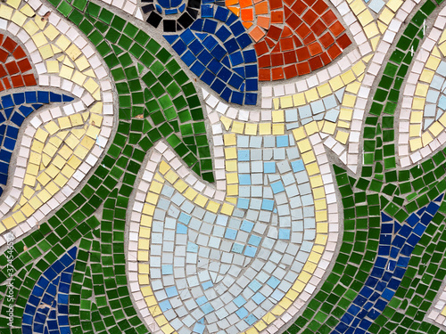 Detail of beautiful old collapsing abstract ceramic mosaic adorned building. Venetian mosaic as decorative background. Selective focus. Abstract Pattern. Abstract mosaic colored ceramic stones