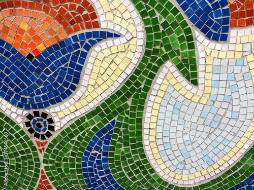 Detail of beautiful old collapsing abstract ceramic mosaic adorned building. Venetian mosaic as decorative background. Selective focus. Abstract Pattern. Abstract mosaic colored ceramic stones