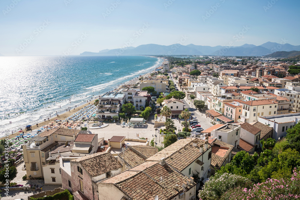 Panoramic landscape of the city and the beach od Sperlonga at 

sunset. Aerial view. Italian coastline.
