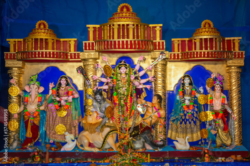 Durga Puja or Durgotsava,is an annual Hindu festival celebrated mainly in West Bengal,Indian.Durga is Goddess riding a lion with many arms each carrying weapon and defeating evil power of Mahishasura.