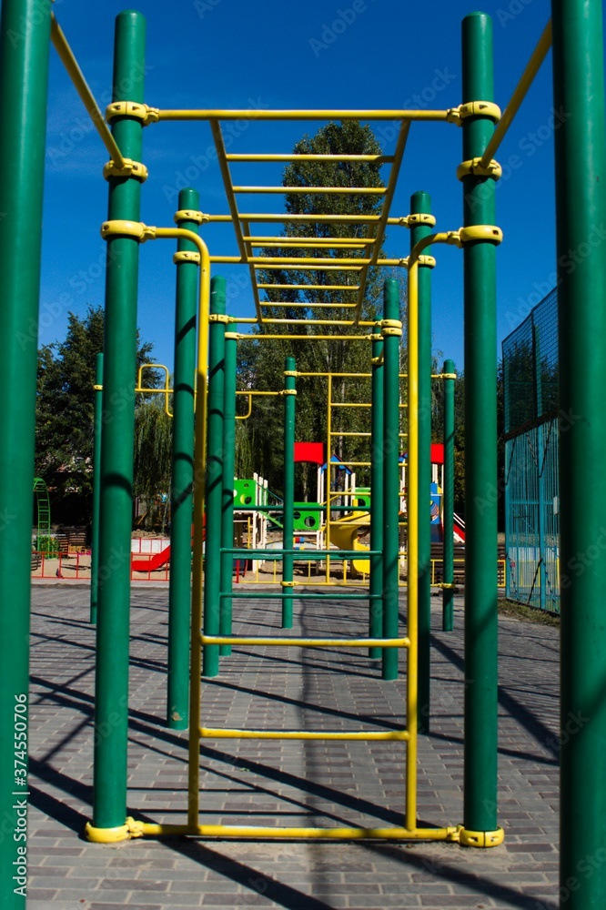 metal outdoor sports equipment in yellow and green color metal outdoor sports equipment in yellow and green color